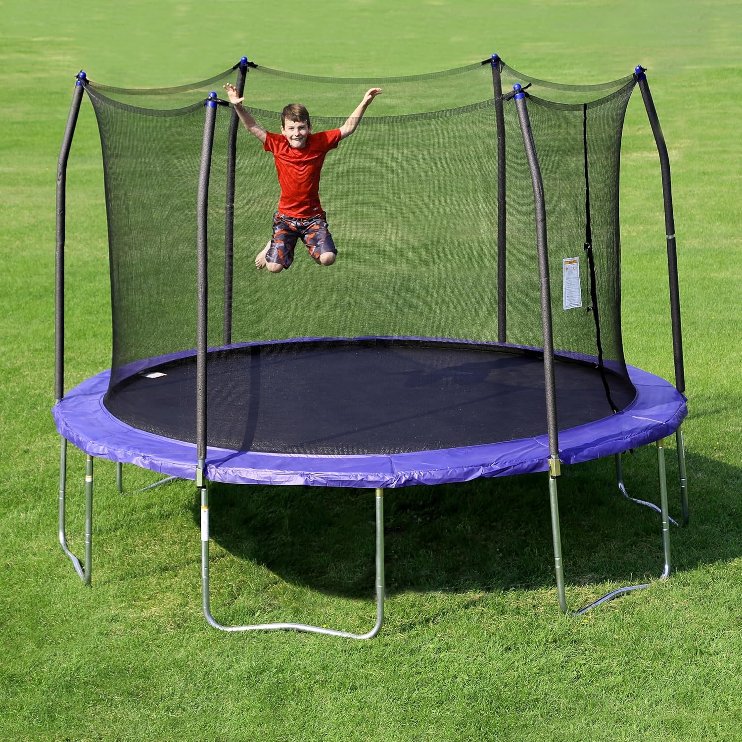 A 12-foot-diameter circular trampoline with protective railings, equipped with spring pads